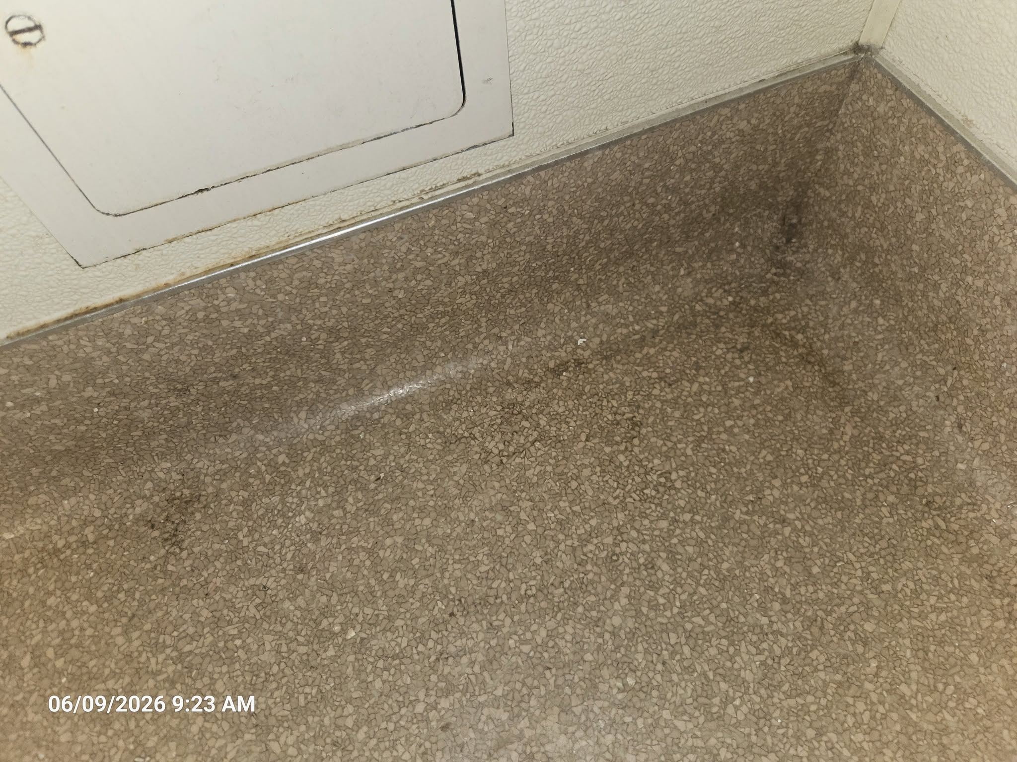 Heavy floor buildup before Desert Clean service